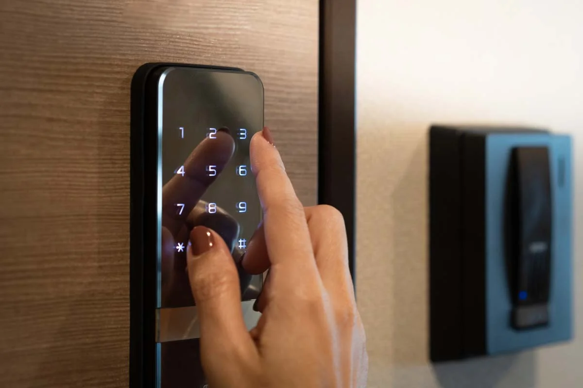 Guest using a digital smart lock keypad for an automated vacation rental check-in