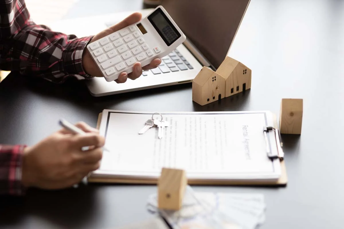 Real estate investor calculating rental property profitability and operating costs