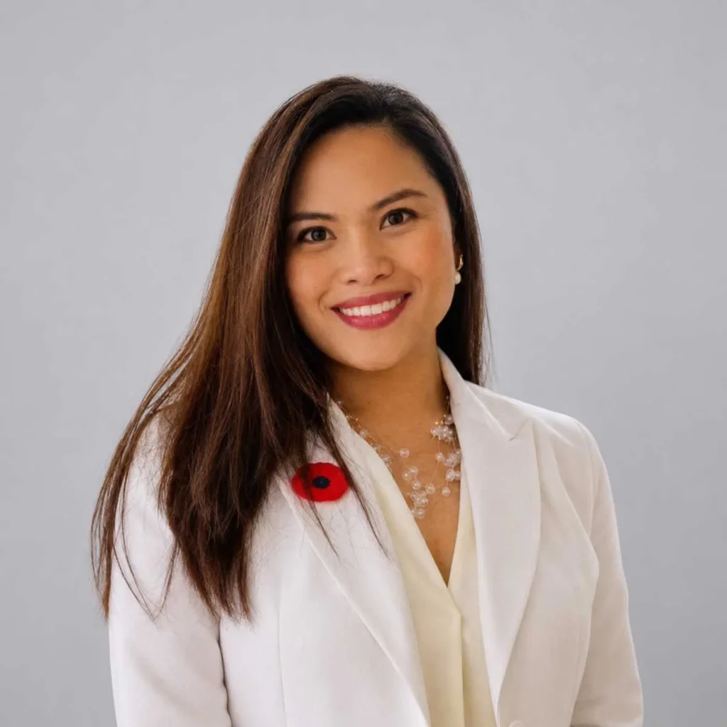 Professional headshot of Rheka Orga, a content writer for Guestable, a short term rental company