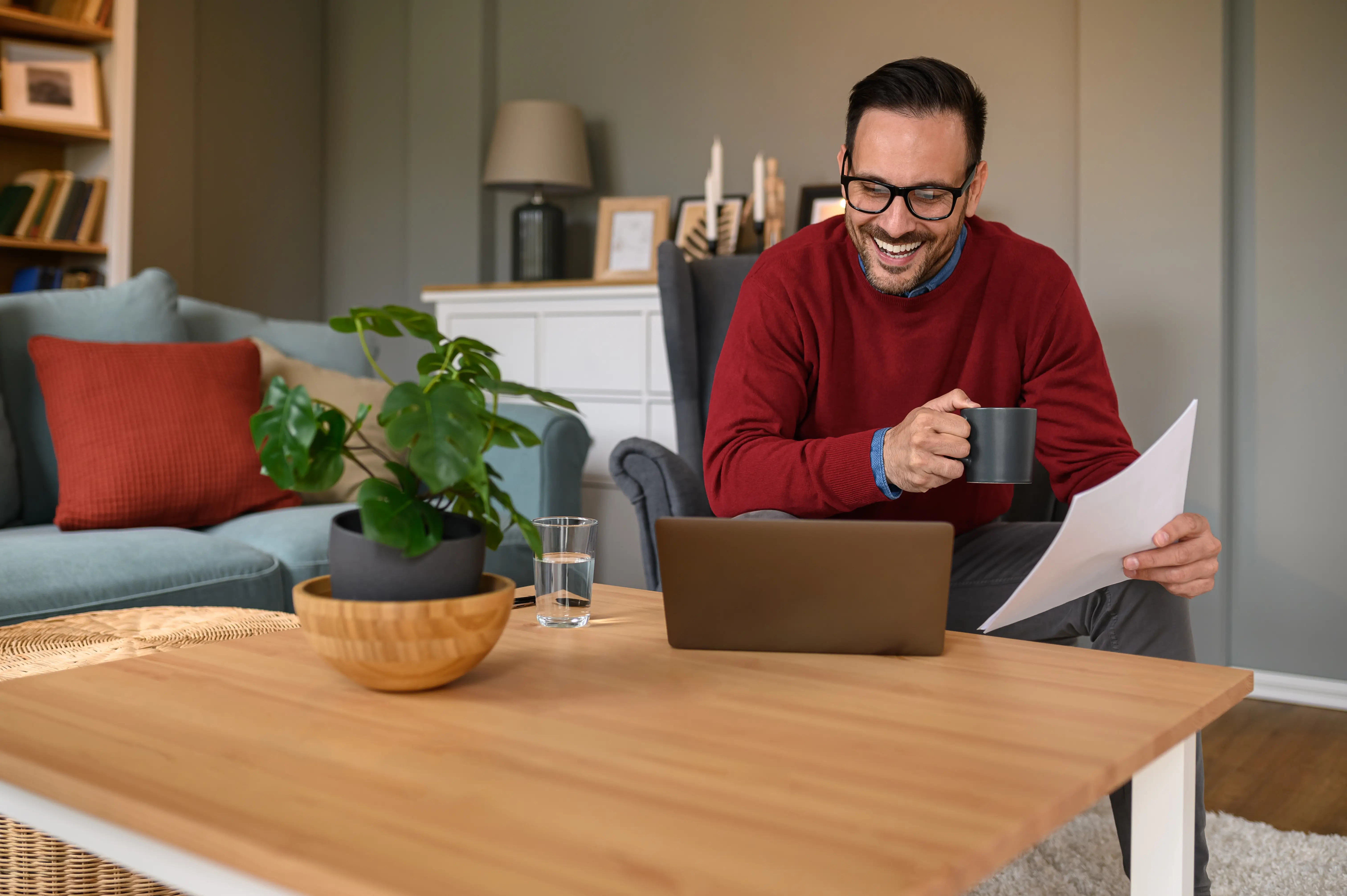 Property owner reviewing vacation rental revenue analytics and booking calendar on a laptop