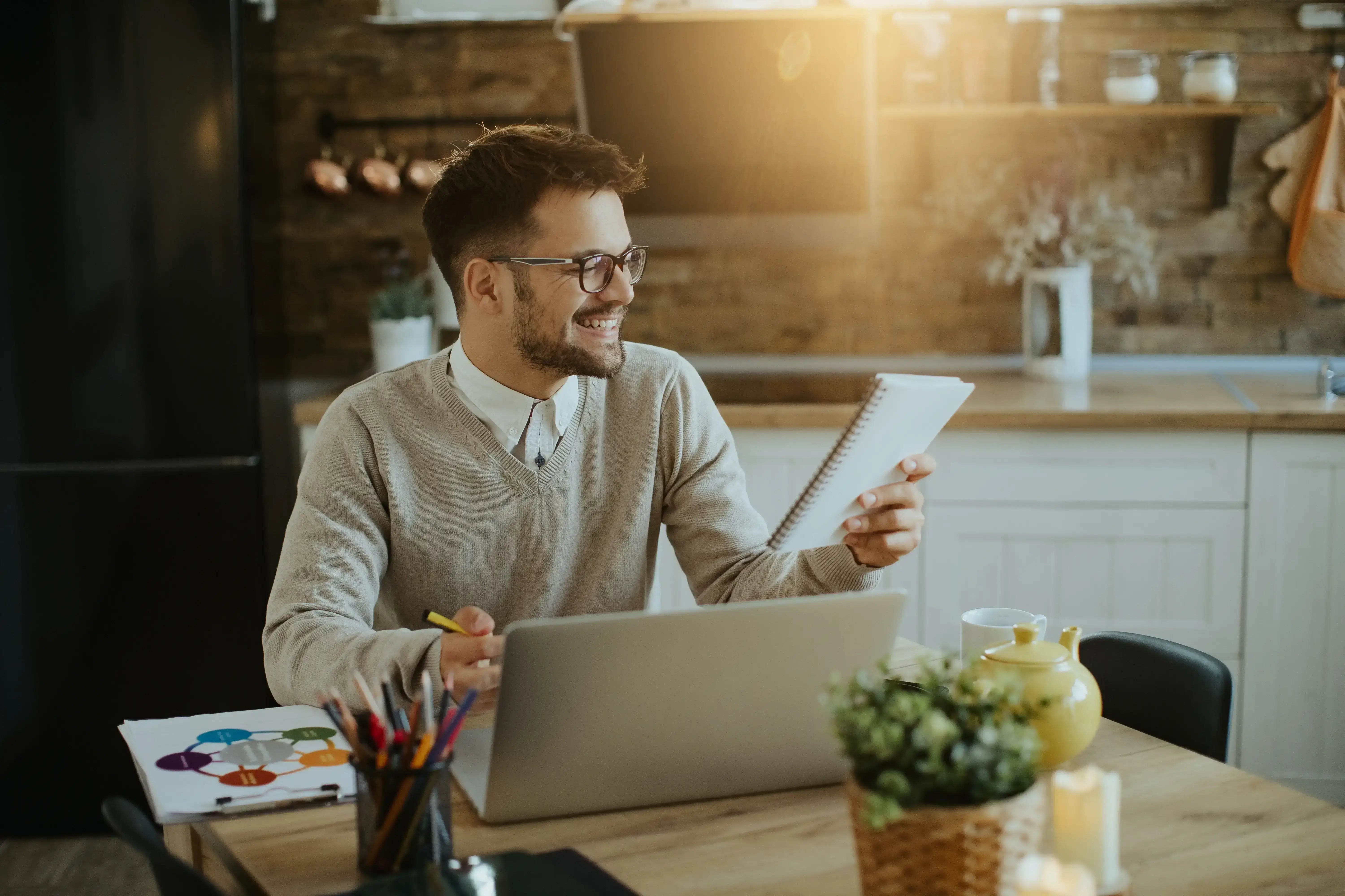 Rental property owner reviewing booking revenue and operating expenses on a notebook.