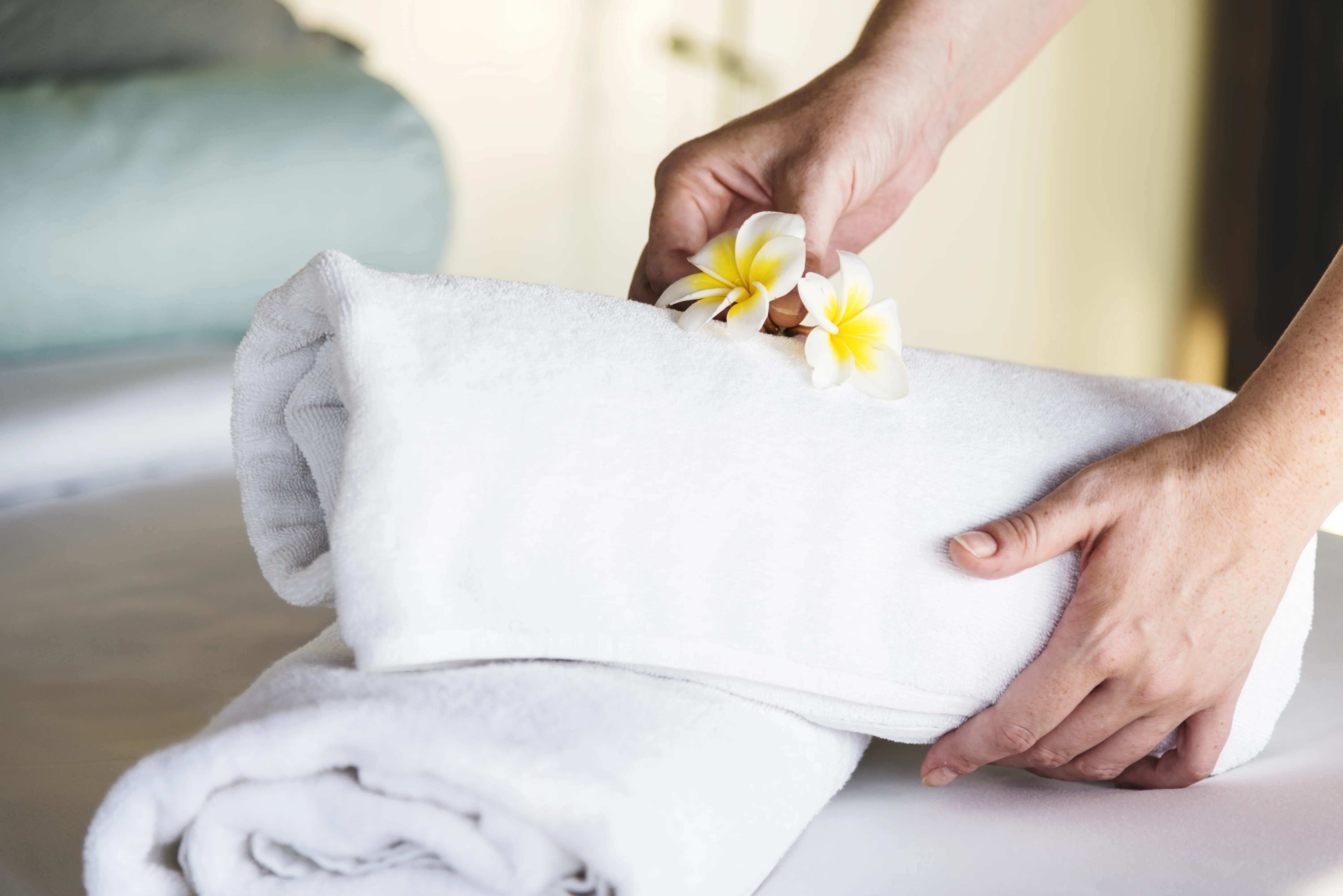 A housekeeper preparing a West Palm Beach rental property between guest stays