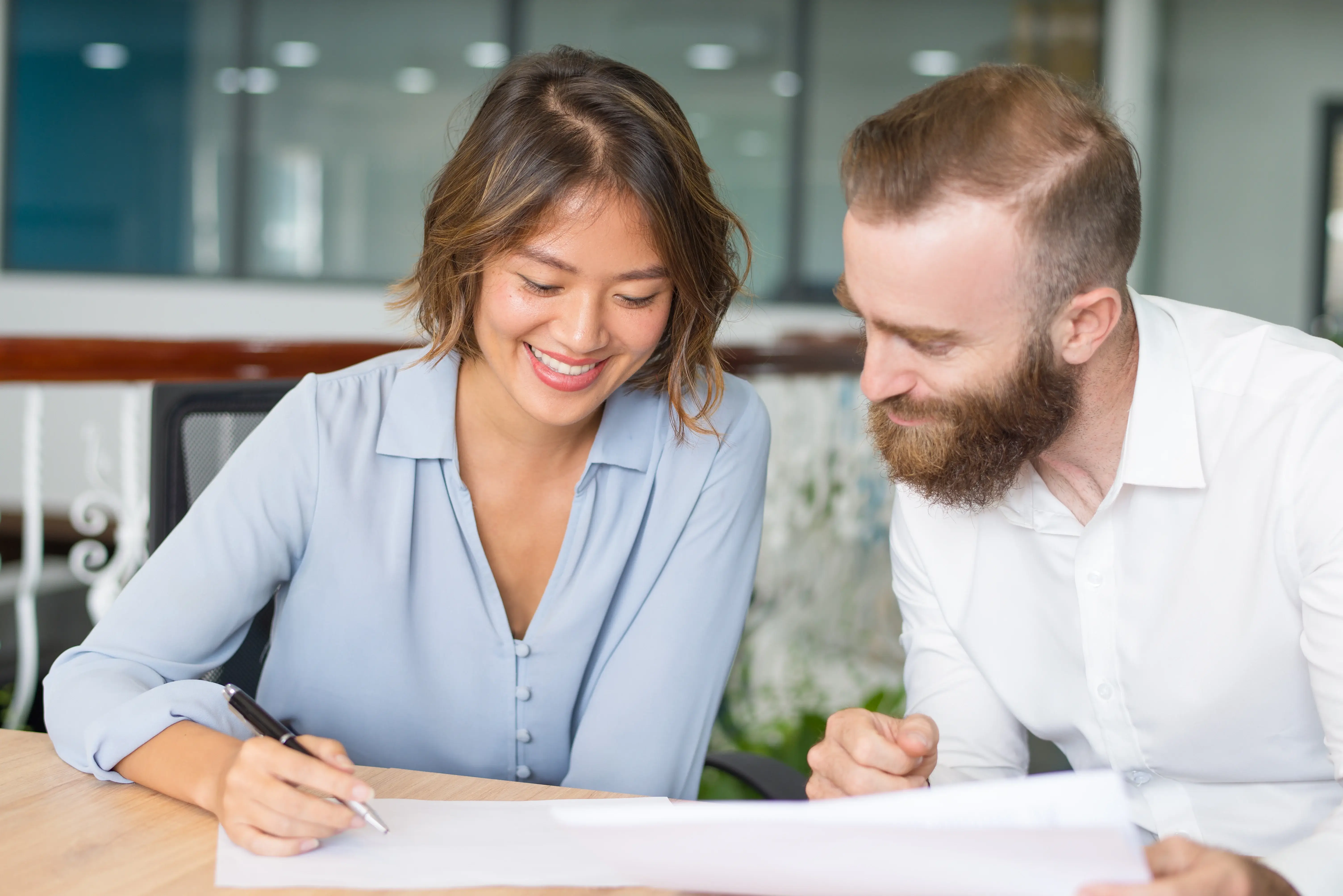 An optimistic property owner filling up some forms inside an office