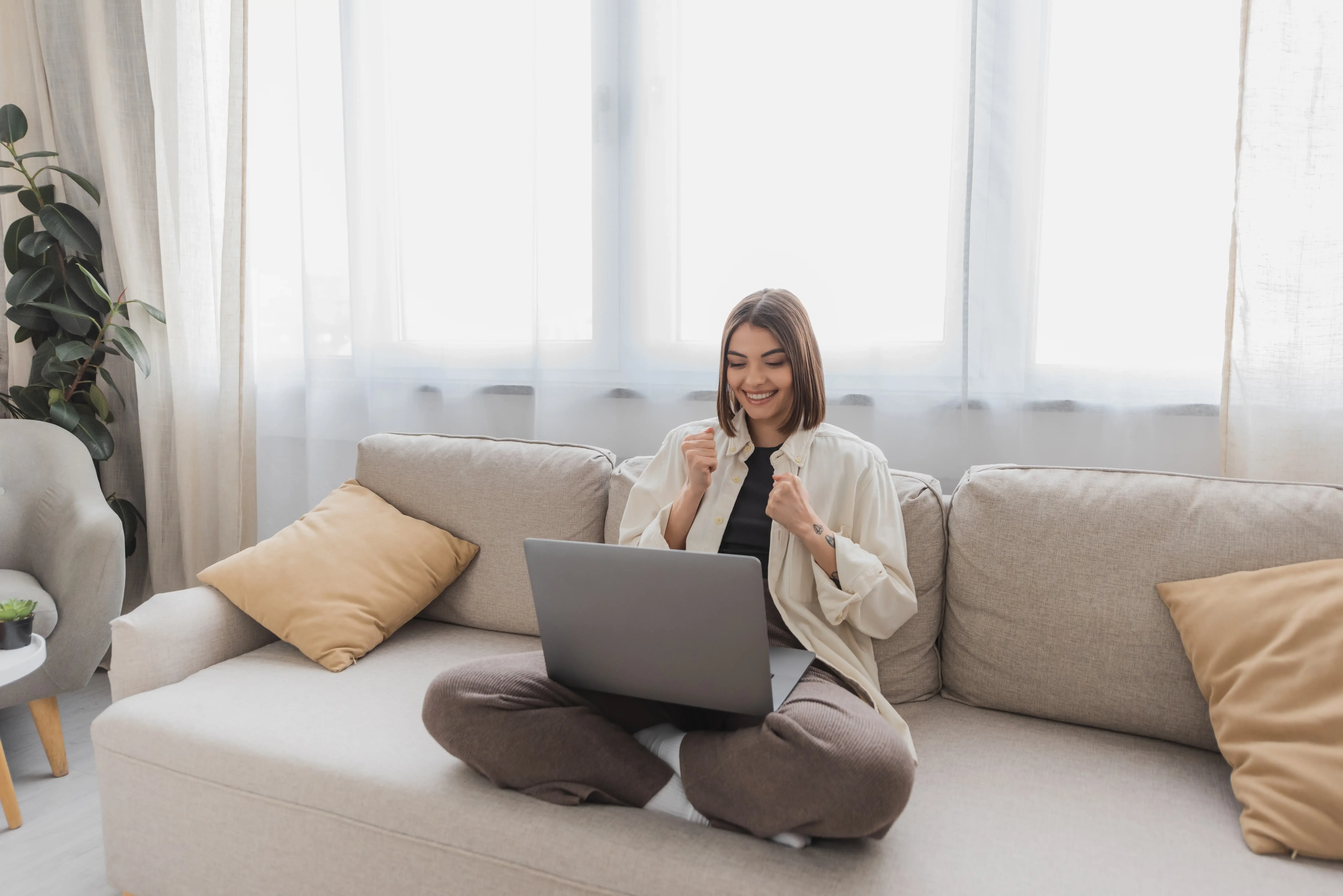 Happy property owner feeling celebratory inside hisher airbnb condo