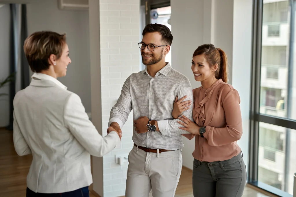 Homeowner shaking hands with a Guestable property manager after a consultation