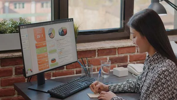 Laptop screen showing dynamic pricing charts and revenue management analytics