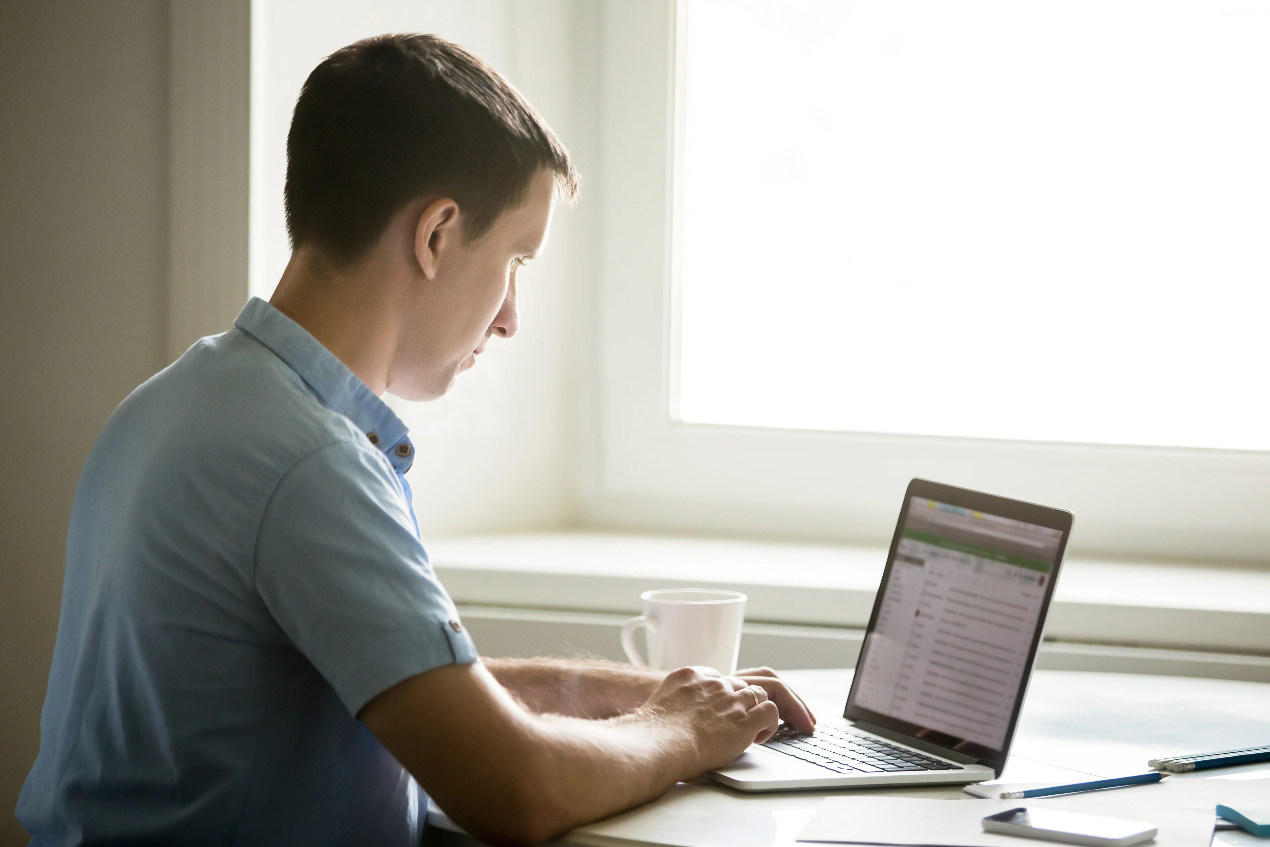 Person filling out an online lodging license application on a laptop