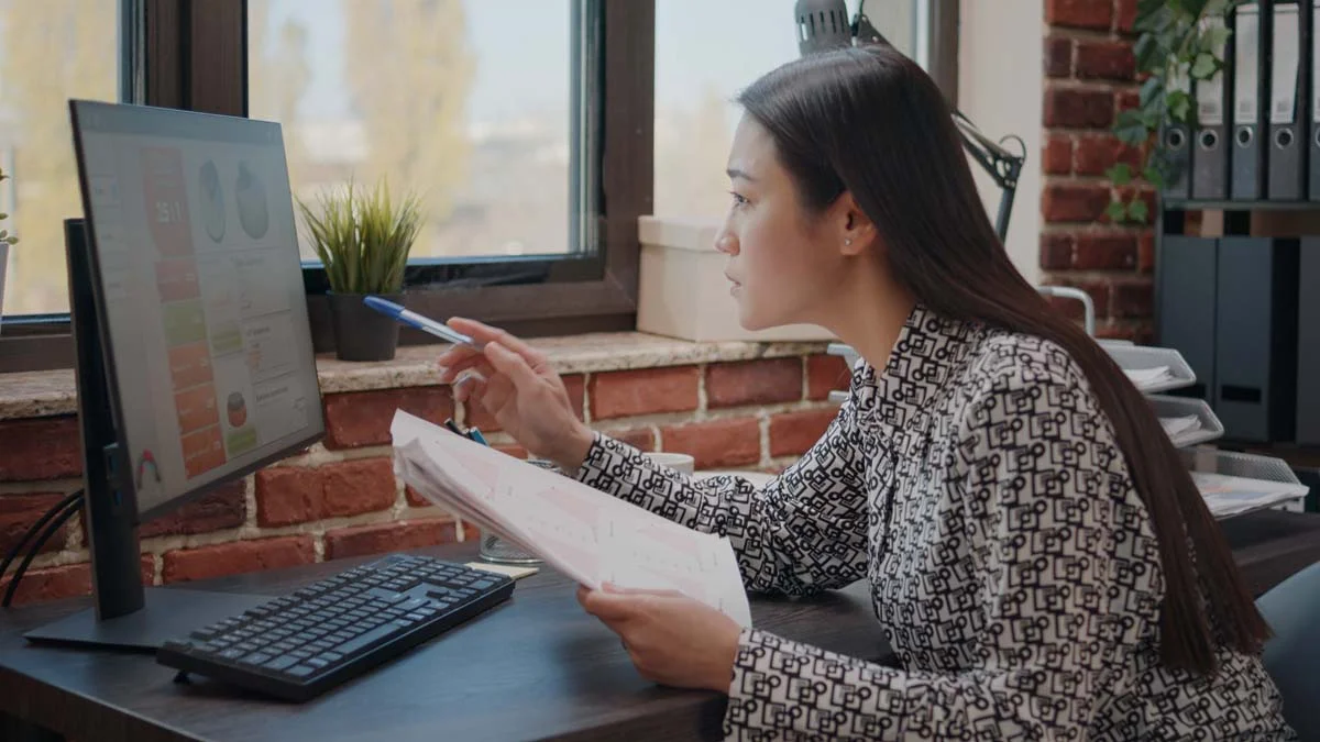 Property manager reviewing Airbnb booking and revenue records for a Toronto short-term rental