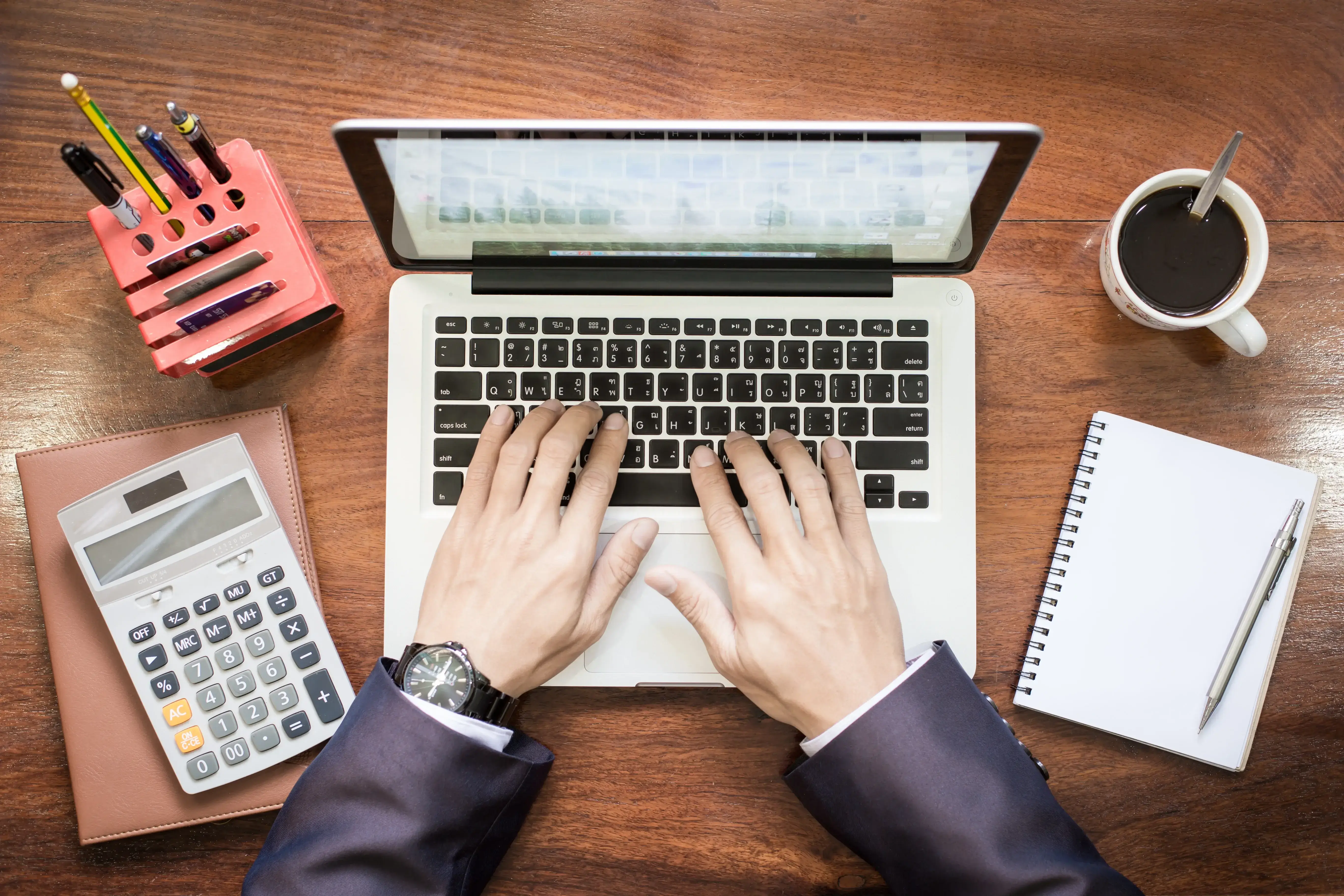 Property manager reviewing dynamic pricing and revenue analytics on a laptop