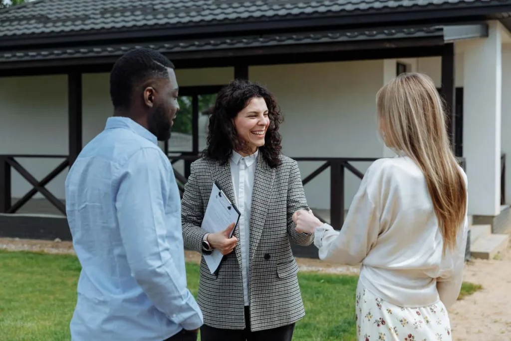 Vacation rental property manager greeting a homeowner outside their rental property