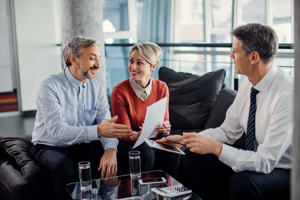 happy homeowners and property manager at a property rental management meeting