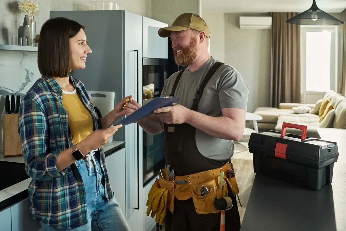A homeowner and professional technician discuss home maintenance