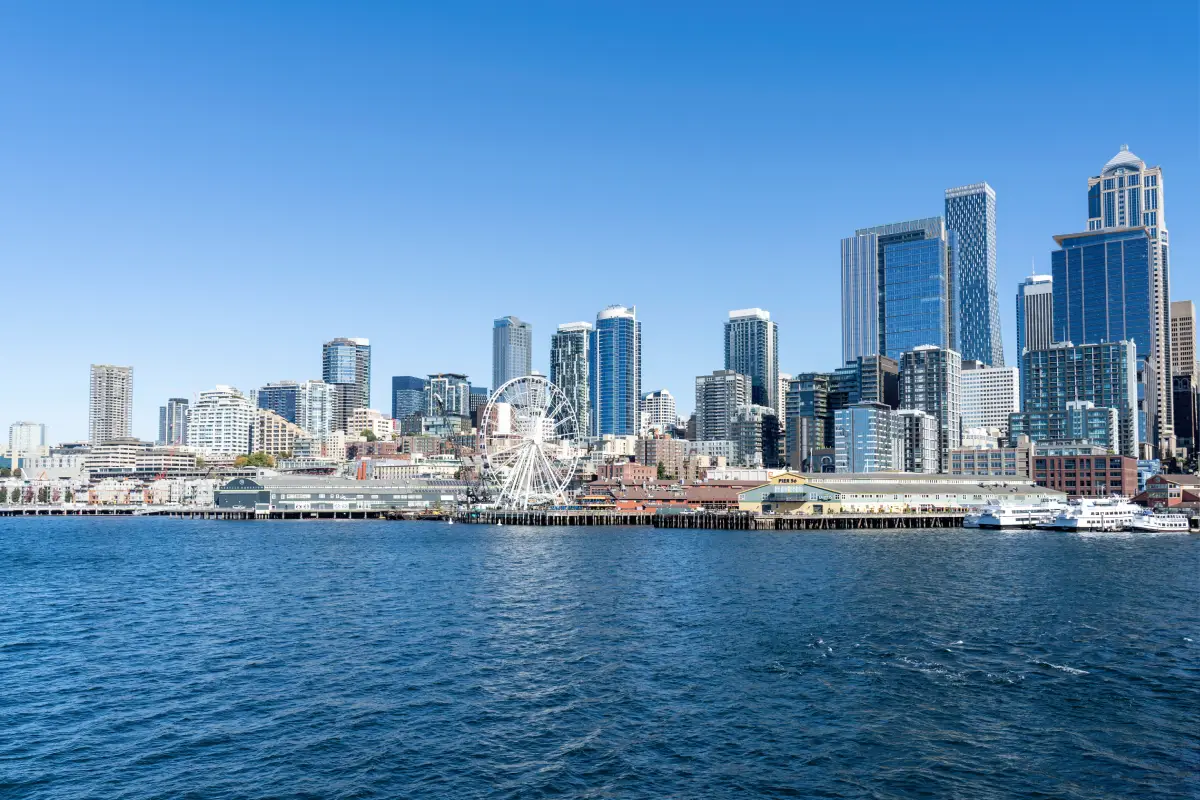 Sunlit Seattle waterfront skyline.